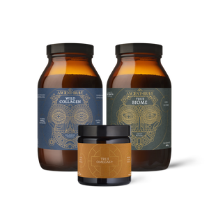 Three amber glass supplement containers from Ancient + Brave: two large bottles labeled Wild Collagen and True Biome, and one smaller jar labeled True Omegas+ with a tan label and black lid.