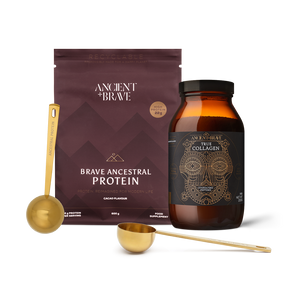 Brave Ancestral Protein packaging with a jar of True Collagen and two Ritual Scoops on a blank background